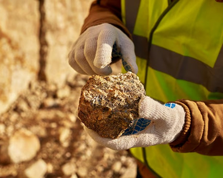 Mining hands with ore